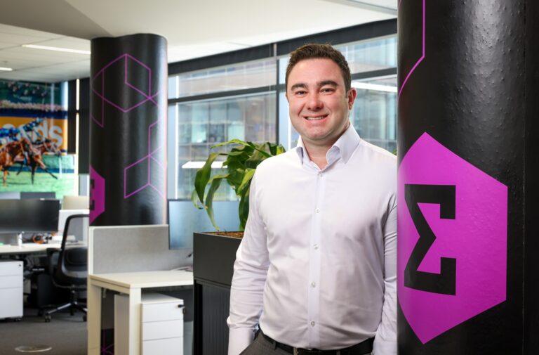 andrew vouris entain ceo standing in office